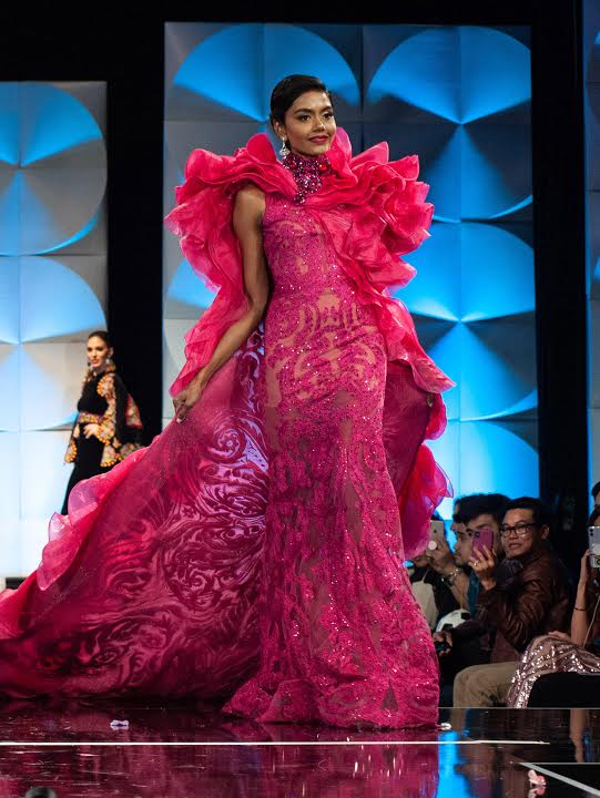 Fashion model,Fashion,Fashion show,Clothing,Dress,Fashion design,Gown,Pink,Formal wear,Haute couture